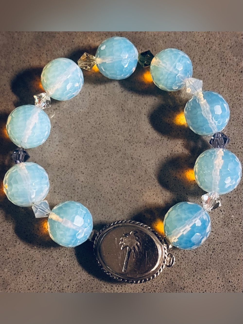 Blue Faceted Bead Stretch Bracelet with sterling silver Palm Charm